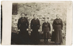 Three Women and a Girl Posing for Group Photograph
