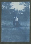 Photograph of Reverend William Kennedy Brown and Martha McClellan Brown, walking along a path, 1904