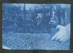 Photograph of Orvon Graff Brown seated in horse and buggy beside the school building, 1903
