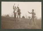 Photograph of two unidentified Miami Military Institute cadets in uniform, holding another cadet at mock gunpoint, 1904