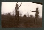 Photograph of two unidentified Miami Military Institute cadets in uniform, with another cadet at mock gunpoint, 1904