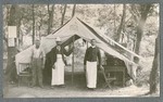 Photo of three men in front of tent during Miami Military Institute encampment, 1901