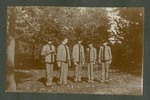 Photograph of five Miami Military Institute cadets posed, standing, in a wooded area, 1904
