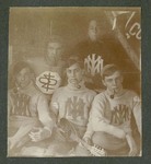Photograph of five unidentified Miami Military Institute cadets, wearing sweaters with school emblems, 1904