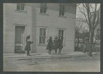 Photograph of five girls skipping rope on a sidewalk, 1904