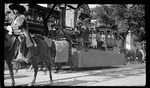 Horse-drawn parade float, featuring a Stephenson steam engine, during the 1909 Wright Brothers Homecoming Celebration