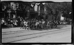 Dayton Glee Club members dressed as troubadours marching in the parade during the 1909 Wright Brothers Homecoming Celebration by Andrew S. Iddings