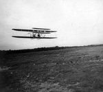 Wilbur Wright piloting a Wright Model A Flyer at Le Mans