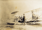 Wilbur Wright and soldiers with the Flyer