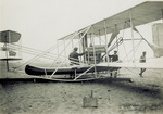 Wilbur Wright preparing for flight by Paul Thompson