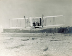 Wilbur Wright taking off in the Flyer by Brooklyn Eagle