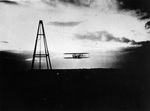 Modern print of Wilbur Wright in flight at dusk or sunset