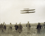 Wilbur Wright flies overhead in the Wright Model A Flyer