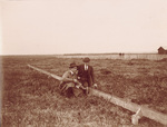 Wilbur Wright and Lovelace working on the launch rail by Jacques