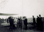 Wilbur Wright standing with spectators at Le Mans