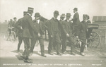 Wilbur Wright with mechanics and government officials