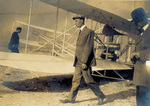 Wilbur Wright walking near the Flyer