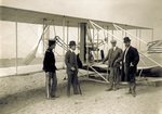Wilbur Wright and others in front of the hangar
