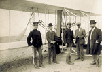 Wilbur Wright and others in front of the Flyer