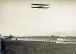 Hoxsey in a Wright Model B Flyer racing an automobile