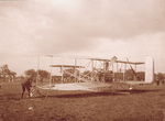 Preparing the Wright Model A Flyer for flight by Marie Mertens