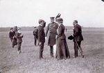 Orville Wright greets a woman and a soldier
