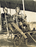 Captain Chandler holding Lewis machine gun in Wright Model B Flyer