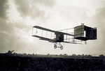 Robert J. Collier piloting a Farman biplane by J. H. Hare