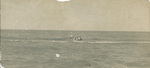 Surf men of the U.S. Life Saving Service rowing from shore