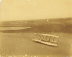 Wilbur Wright gliding down slope.