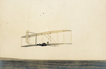 Wilbur Wright piloting the Wright 1902 glider by Wright Brothers