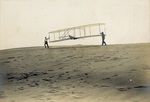 Orville Wright taking off in the Wright 1902 glider by George Spratt