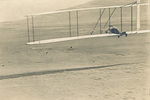 Wilbur Wright gliding in Wright 1902 glider by Wright Brothers