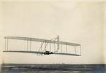 Wilbur Wright gliding in the Wright 1902 glider by Wright Brothers