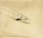 Wilbur Wright piloting the Wright 1902 Glider by Wright Brothers