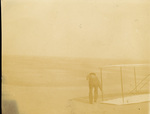 Dan Tate picking up Wright 1902 glider
