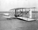 Wilbur Wright and 1903 Flyer after false start by Orville Wright