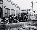 Wright Flyer on cart outside Speedwell Motor Car Company factory