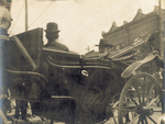 Orville and Milton Wright riding in carriage