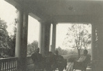Katharine Wright sitting on porch with friends