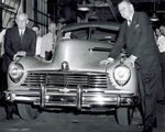 Viewing first 1946 model Hudson automobile off assembly line