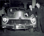 Viewing first 1946 model Hudson automobile off assembly line by Jim Shepperd