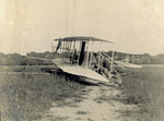 Wright Model A Flyer being placed on launch rail by C. H. Claudy