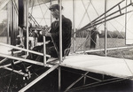 Wilbur Wright at the controls of his plane