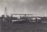 Men observing the Wright Flyer before the launch