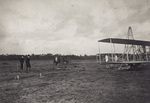 Men looking at Wright 1907 Model Flyer