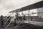 Wilbur Wright working on the motor at Camp d'Auvours