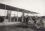 Wilbur Wright inspecting the plane before a flight