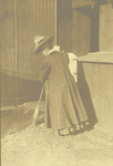 Katharine Wright sweeping with a broom