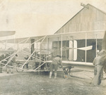 Soldiers placing wheels under the wings of the Wright Model A Flyer